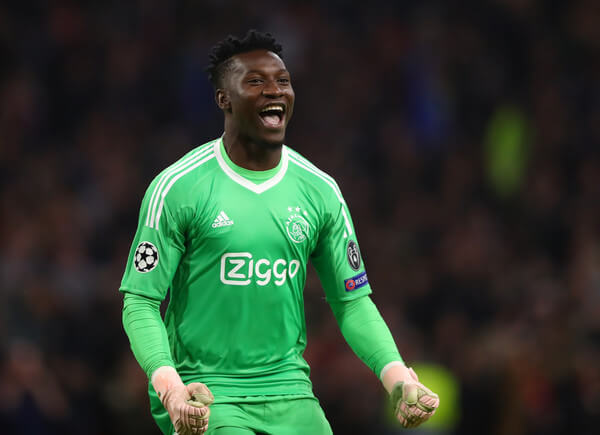 Andre Onana of Ajax celebrates after Noussair Mazraoui of Ajax (not pictured) scores his team's first goal during the Group E match of the UEFA Champions League between Ajax and SL Benfica at Johan Cruyff Arena on October 23, 2018 in Amsterdam, Netherlands. (Oct. 22, 2018 - Source: Dean Mouhtaropoulos/Getty Images Europe)