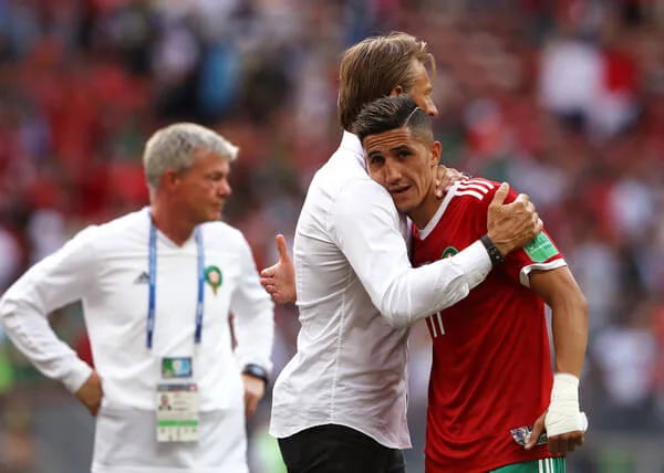 Herve Renard, Head coach of Morocco consoles Faycal Fajr of Morocco who looks dejected following his sides defeat, meaning his team are knocked out of the World Cup after the 2018 FIFA World Cup Russia group B match between Portugal and Morocco at Luzhniki Stadium on June 20, 2018 in Moscow, Russia. (June 19, 2018 - Source: Michael Steele/Getty Images Europe)