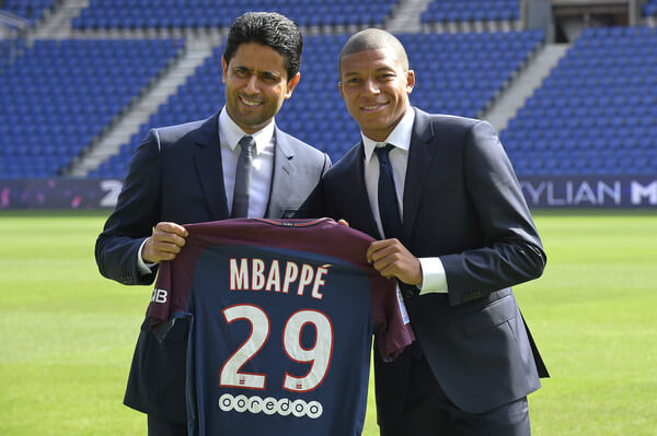 (L-R) Paris Saint-Germain President Nasser Al Khelaifi poses alongside new signing Kylian Mbappe at the Parc des Princes on September 6, 2017 in Paris, France. Kylian Mbappe signed a five year contract for 180 Million Euro. (Sept. 5, 2017 - Source: Aurelien Meunier/Getty Images Europe)