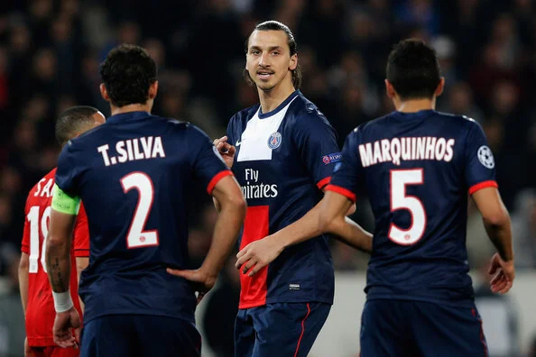 Zlatan Ibrahimovic (C) of PSG speaks to team mates Thiago Silva and Marquinhos during the UEFA Champions League Round of 16 second leg match between Paris Saint-Germain FC and Bayer Leverkusen at Parc des Princes on March 12, 2014 in Paris, France. (March 11, 2014 - Source: Dean Mouhtaropoulos/Getty Images Europe)
