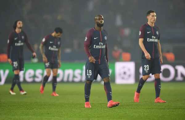 Lassana Diarra of PSG (19) and team mates look dejected in defeat after the UEFA Champions League Round of 16 Second Leg match between Paris Saint-Germain and Real Madrid at Parc des Princes on March 6, 2018 in Paris, France. (March 5, 2018 - Source: Matthias Hangst/Getty Images Europe)