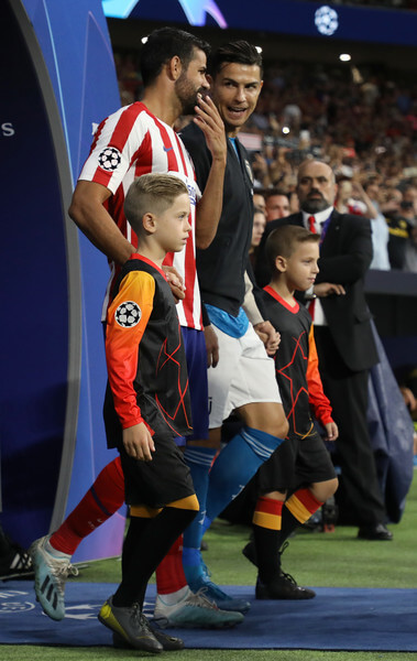 Diego Costa of Atletico Madrid and Cristiano Ronaldo of Juventus walk out onto the pitch prior to the UEFA Champions League group D match between Atletico Madrid and Juventus at Wanda Metropolitano on September 18, 2019 in Madrid, Spain. (Sept. 17, 2019 - Source: ANGEL MARTINEZ/Getty Images Europe)