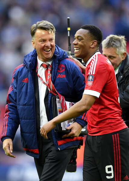 Louis van Gaal manager of Manchester United celebrates with winning goalscorer Anthony Martial of Manchester United after victory in The Emirates FA Cup semi final match between Everton and Manchester United at Wembley Stadium on April 23, 2016 in London, England. (April 22, 2016 - Source: Mike Hewitt/Getty Images Europe)