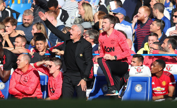Jose Mourinho manager of Manchester United appeals as assistant coach Michael Carrick looks on during the Premier League match between Chelsea FC and Manchester United at Stamford Bridge on October 20, 2018 in London, United Kingdom. (Oct. 19, 2018 - Source: Catherine Ivill/Getty Images Europe)