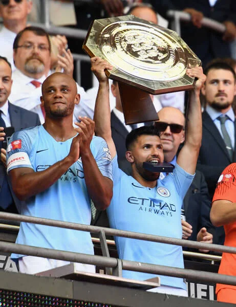 Sergio Aguero of Manchester City celebrates with the Community Shield trophy following his side's victory during the FA Community Shield between Manchester City and Chelsea at Wembley Stadium on August 5, 2018 in London, England. (Aug. 4, 2018 - Source: Clive Mason/Getty Images Europe)