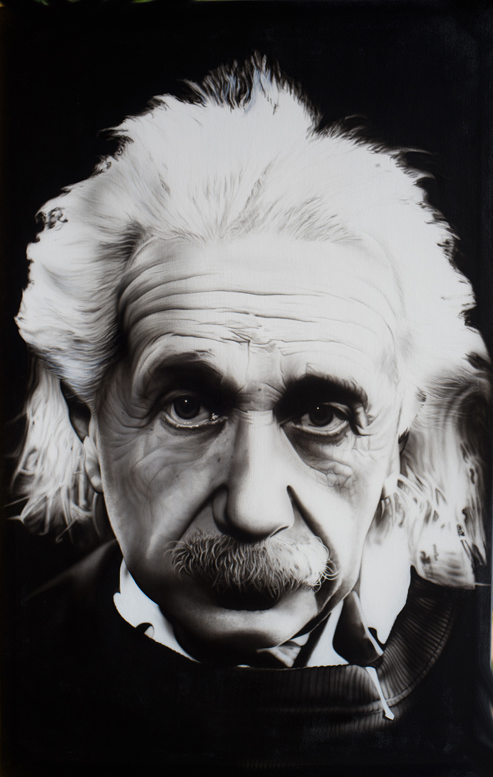 Black and white portrait of Albert Einstein with his characteristic wild hair and mustache
