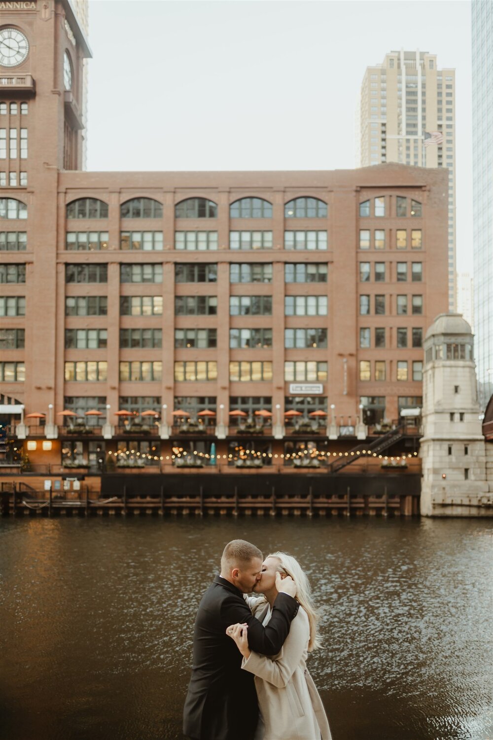 man in in black suit and woman in white dress at chicago river walk wedding portraits. photo by Chicago Wedding Photographers | The Gernands Photography 