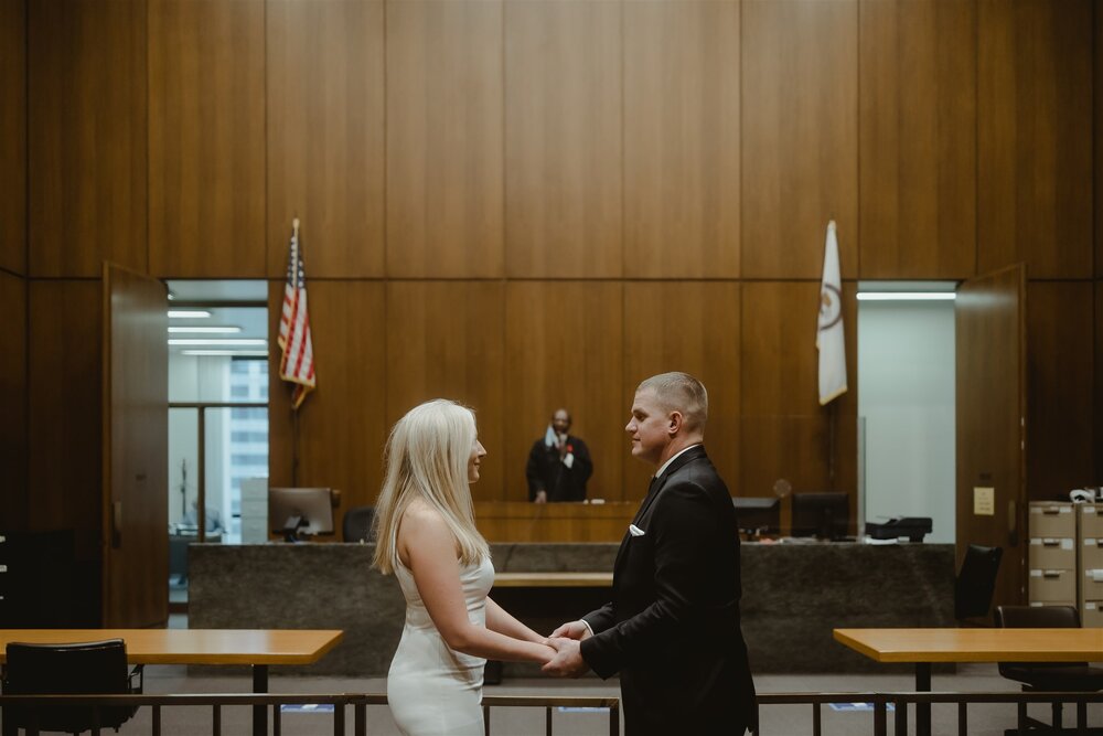 couple having wedding ceremony at chicago city hall. photo by chicago wedding photographers The Gernands Photography