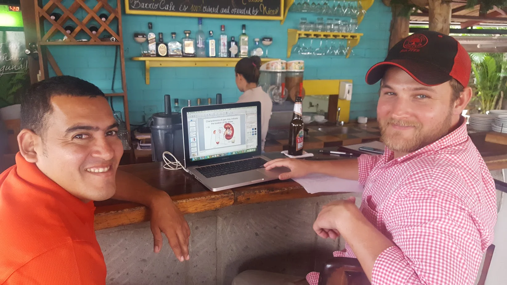 Finishing up the presentation on kidney stones with the interpreter and a cerveza.
