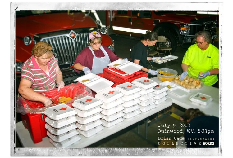 Volenteers prepare meals furnished by the Red Cross.