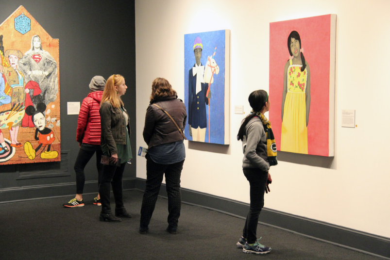 NMWA visitors study Amy Sherald’s It Made Sense…Mostly In Her Mind , 2011 (left) and They call me Redbone but I’d rather be Strawberry Shortcake , 2009 (right); Photo: Emily Haight, NMWA