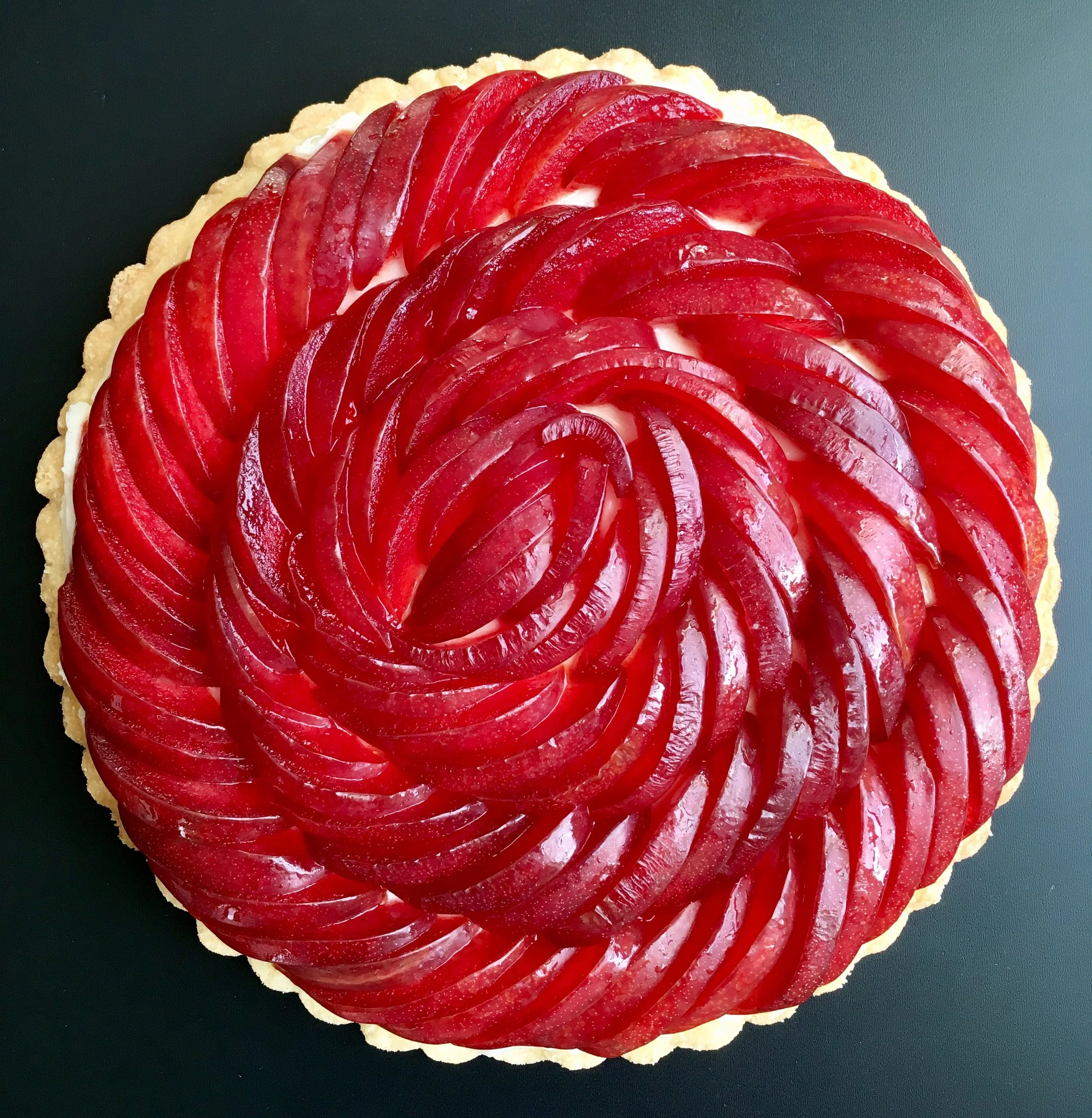  Date: October 5th, 2017   Cross my tart and hope to pie. 🖤| Cream cheese shortbread tart with Dapple Dandy Pluots(!) from our amazing @tilthalliance CSA.  