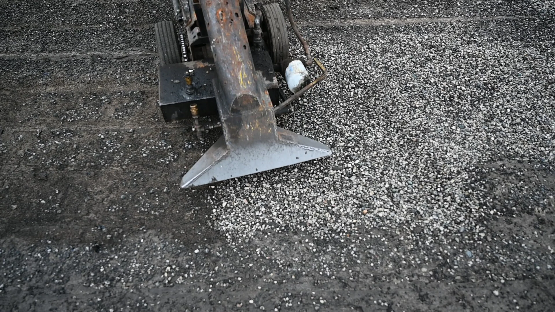 The old tar and gravel material is stripped from the roof.