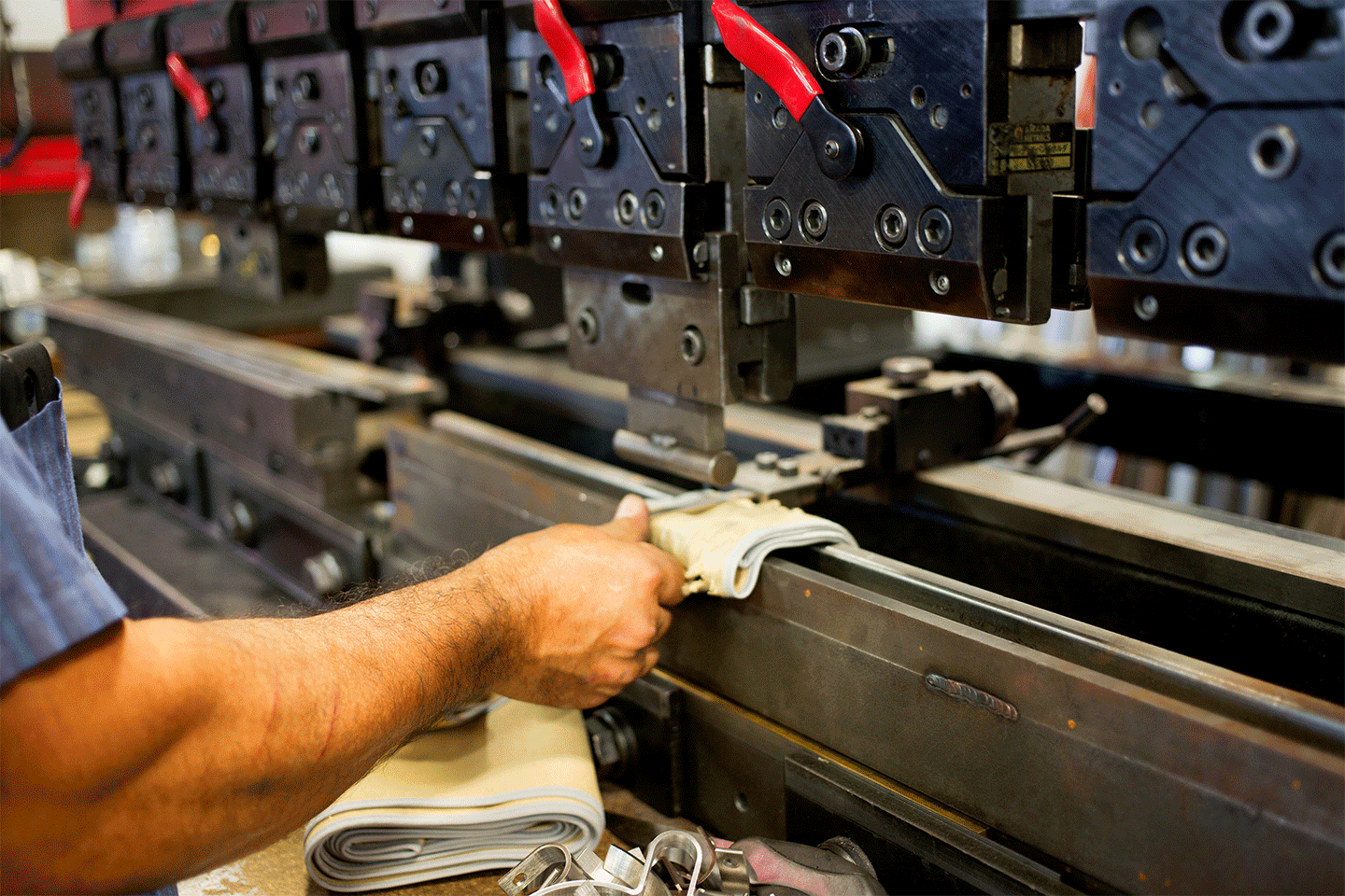 Factory tour photography, pictured is a sheet metal brake in use
