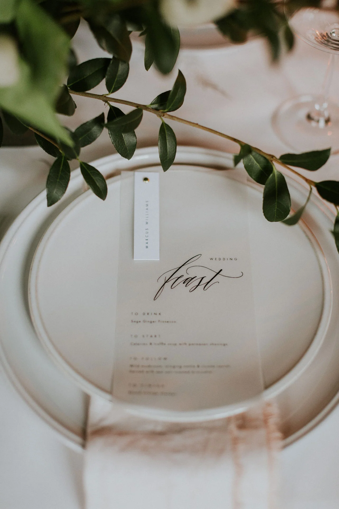 The semi sheer vellum adds a crisp modern feeling to the wedding menus.