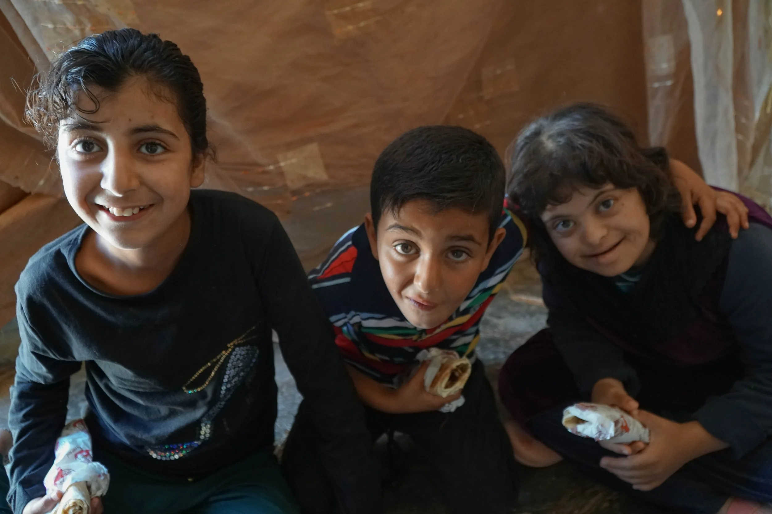 Shahed, Nedal and Fatima enjoying lunch together.