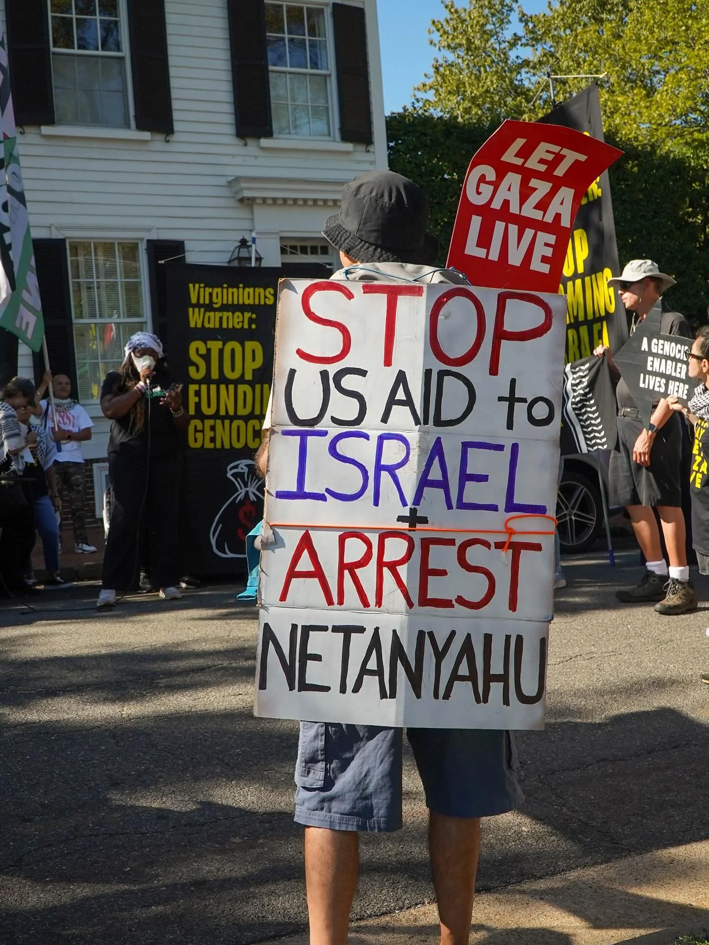 Protest outside VA Senator Mark Warner&rsquo;s house 10/05/2025. Last weekend members of Jewish Voice for Peace and other human rights groups marched through Alexandria, VA demanding that Senator Mark Warner stop voting to send more weapons and aid t