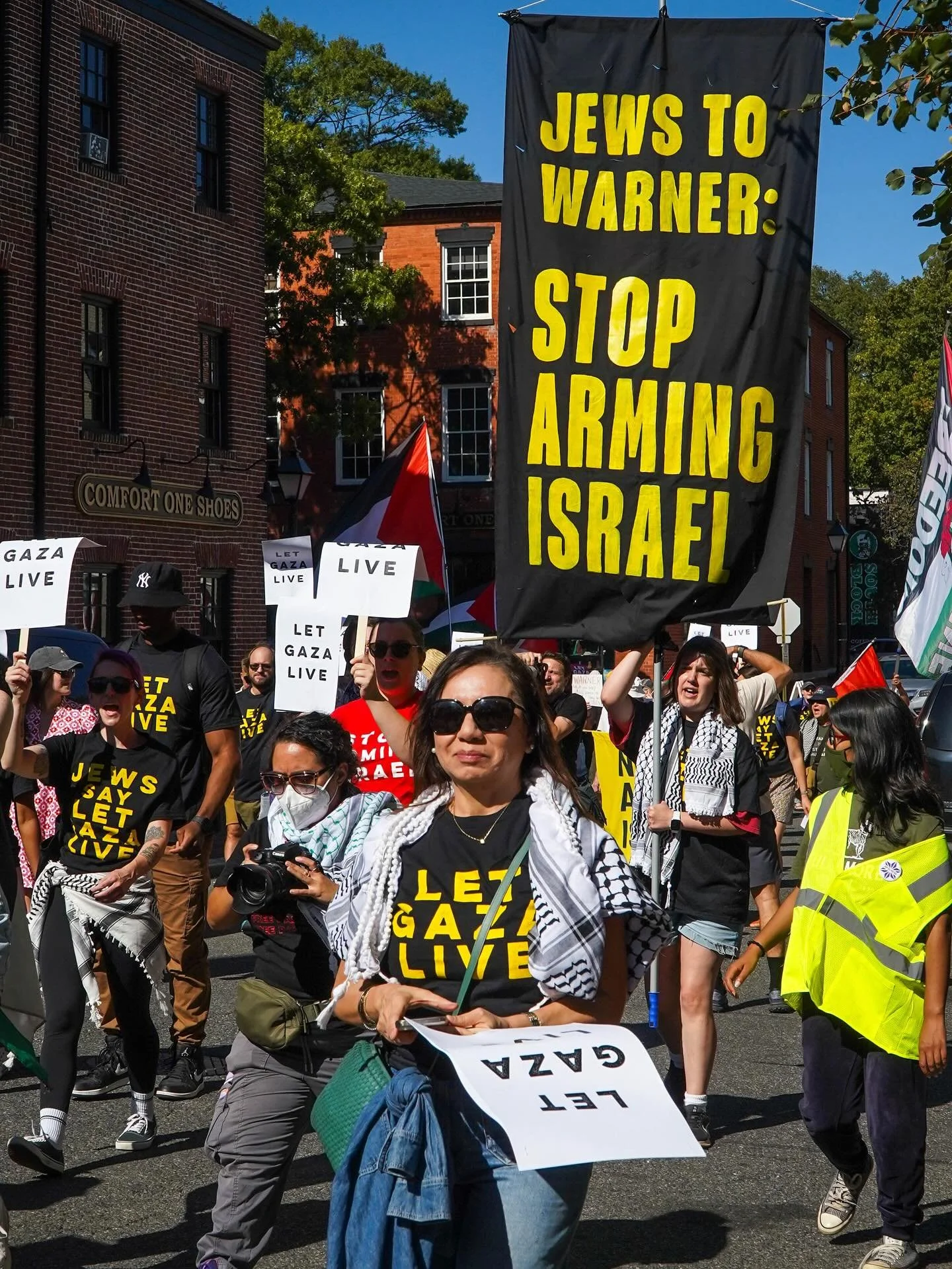 Protest outside VA Senator Mark Warner&rsquo;s house 10/05/2025. Last weekend members of Jewish Voice for Peace and other human rights groups marched through Alexandria, VA demanding that Senator Mark Warner stop voting to send more weapons and aid t