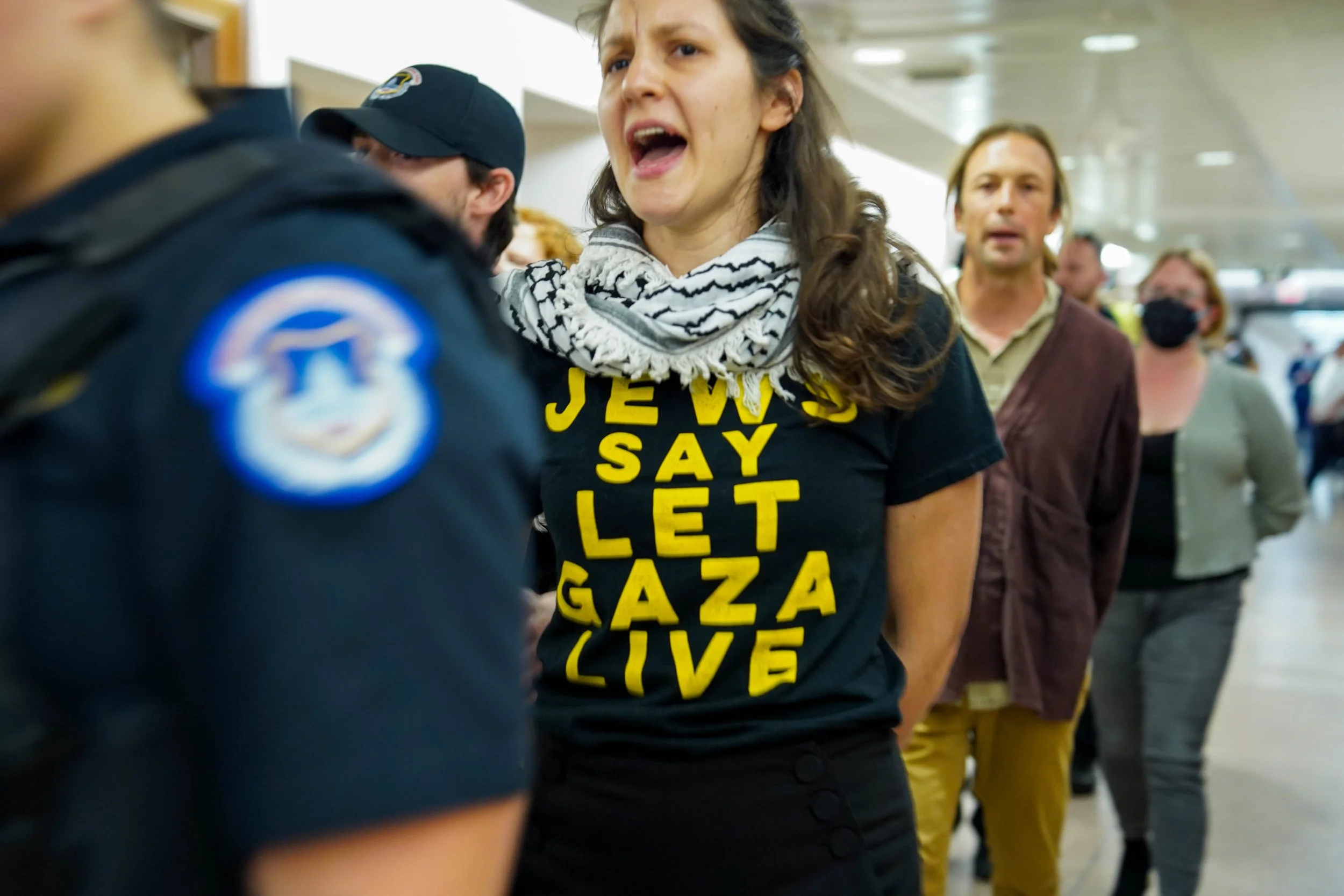 Faith leaders from an interfaith activist group arrested for staging a protest in the U.S. Capitol Senate and Congress buildings.