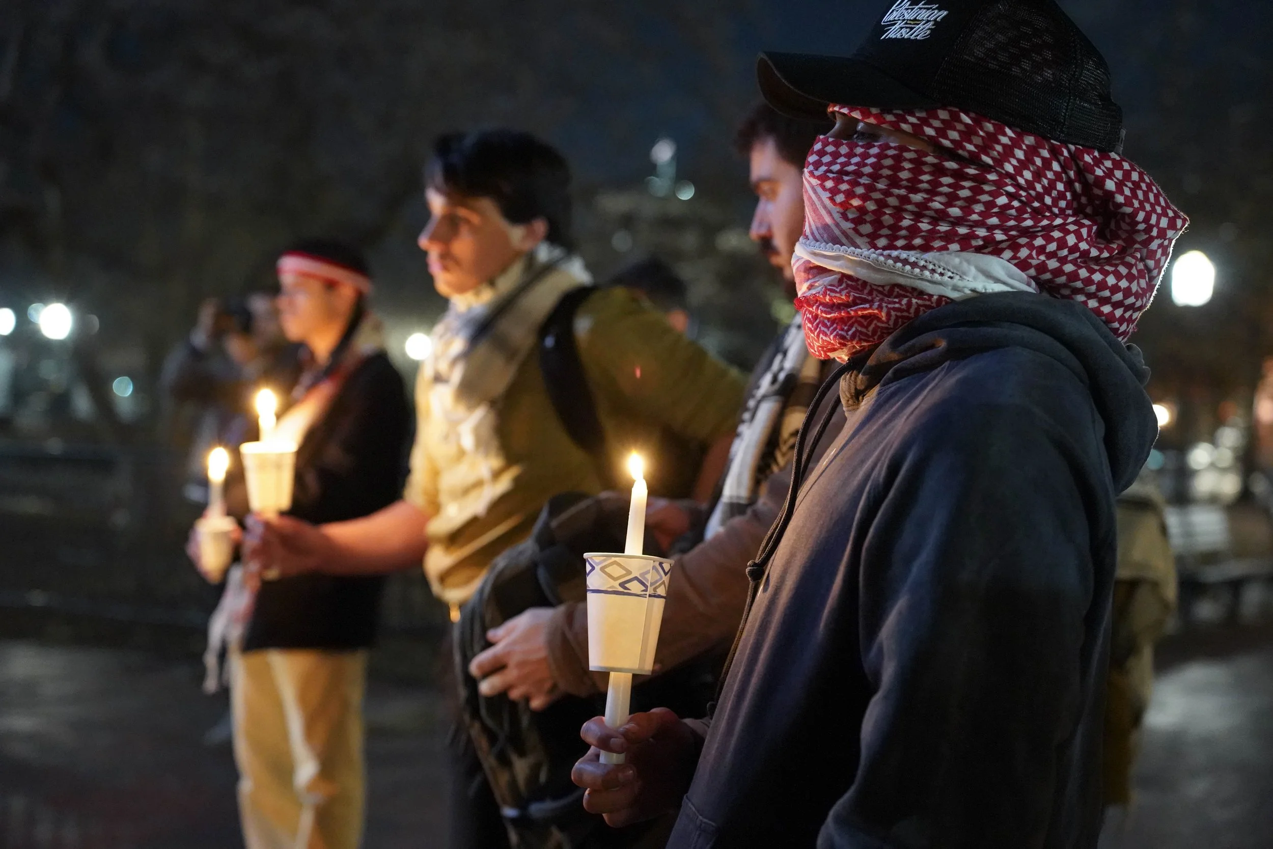 crowd holding candles.jpg