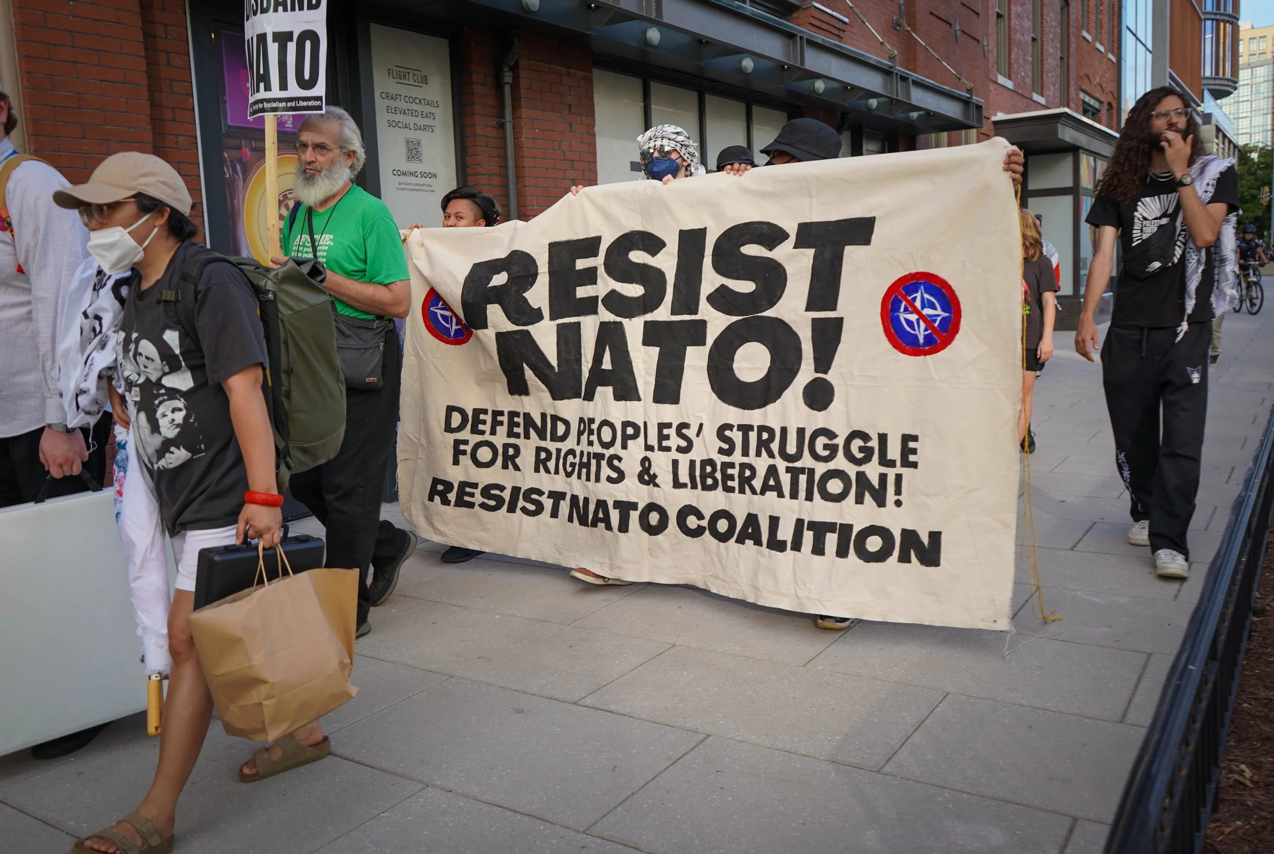 Resist NATO banner marching.jpg