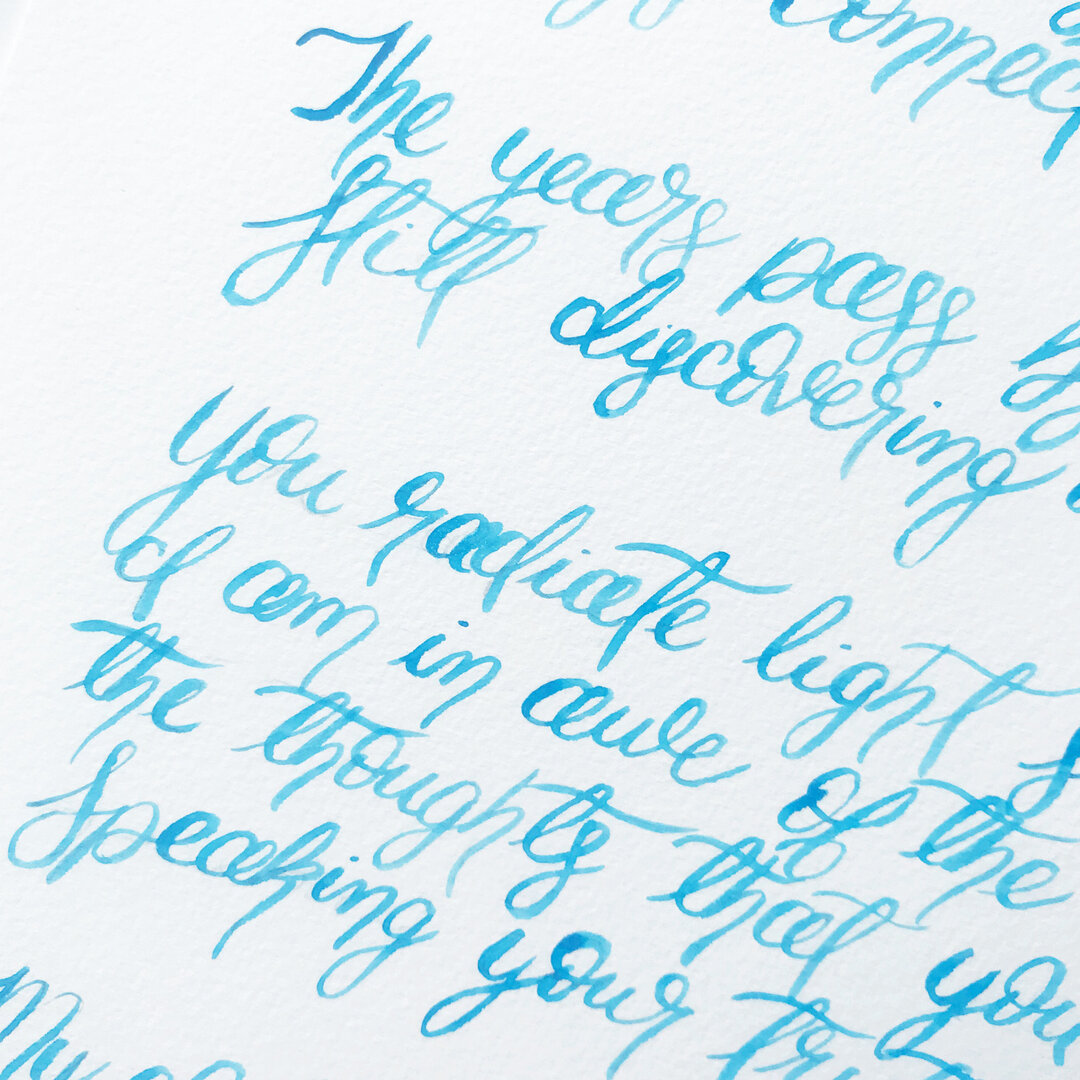 Brush calligraphy in teal blue 👀💙