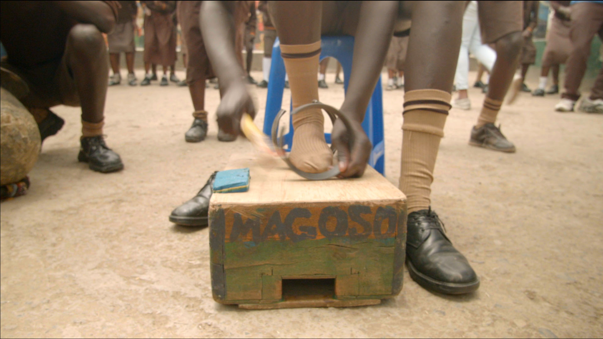 Young Kenyan Playing Percussion Instrument