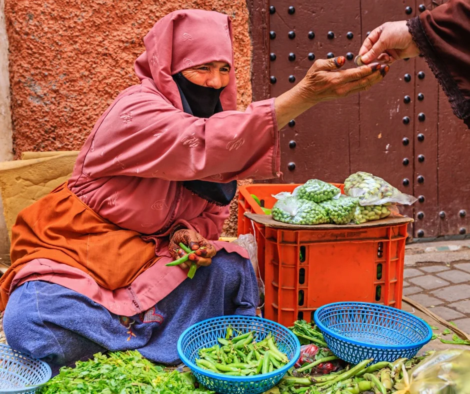MARRAKECHmorrocan-woman-selling-vegetables-on-street-market-FACEBOOK.jpg