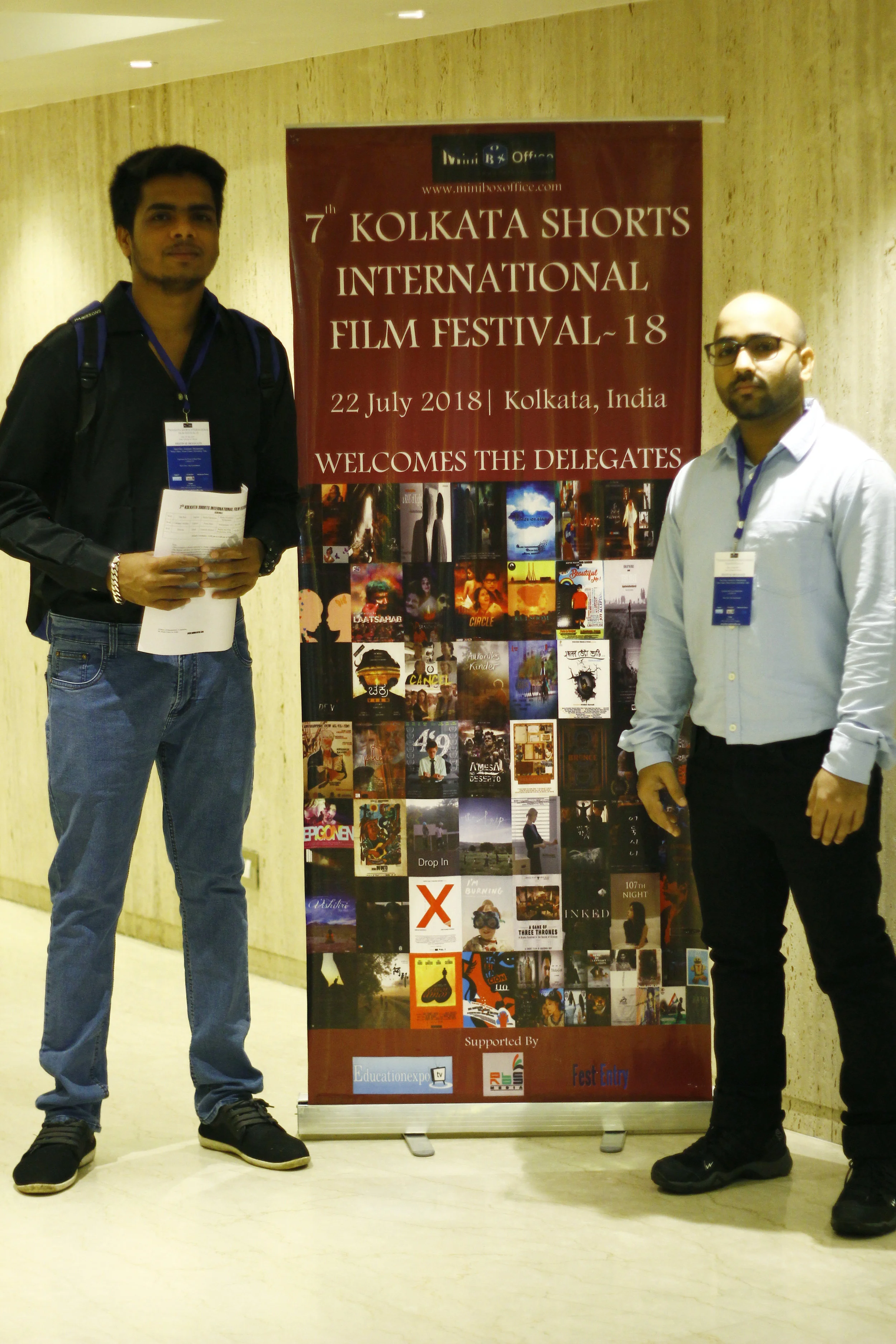 Our Media Executives Rupesh Sahu (left) & Santosh Panigrahi (right) next to the official banner at the festival.