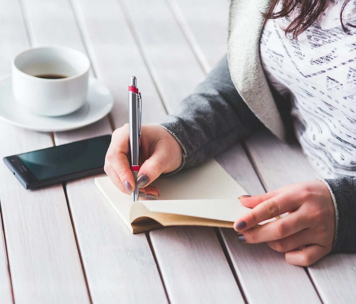 woman with notepad squared off.jpg