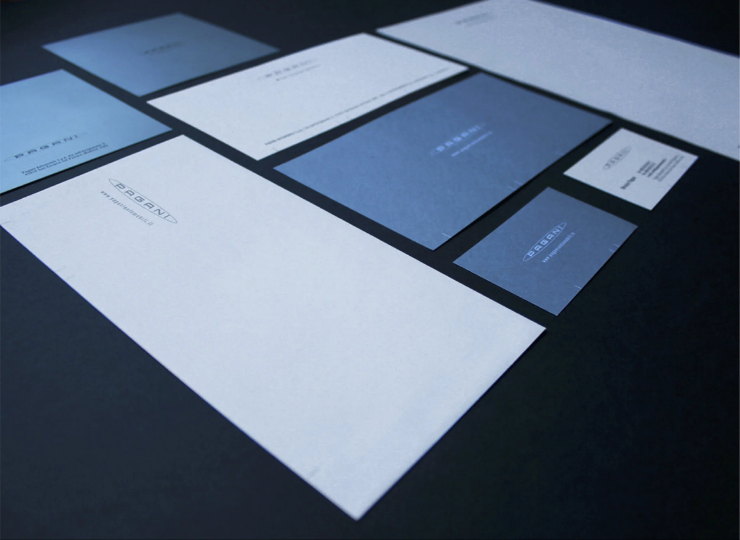 A single font choice, a variety of good quality, dyed and uncoated boards, a blue metallic colour and matte coating each chosen to reflect care and quality of service, introduce a tactile, visual and communicative breadth to the logotype and balance a corporate familiarity and consistency with a sense of individuality.