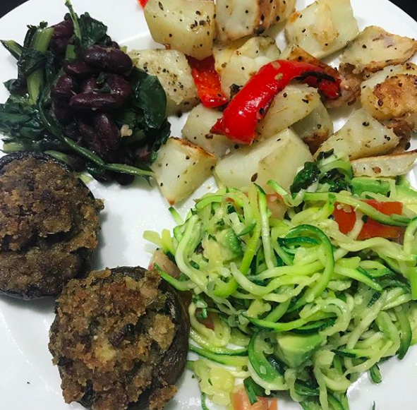 Cooked greens, stuffed mushrooms, roasted potatos and spiralized zucchini noodles