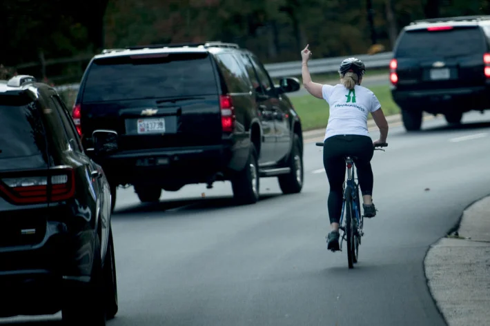 Woman Fired For Flipping Trump's Motorcade the Bird: And If Giving The Middle Finger While Biking Is a Fireable Offense Then I Don't Want a Job