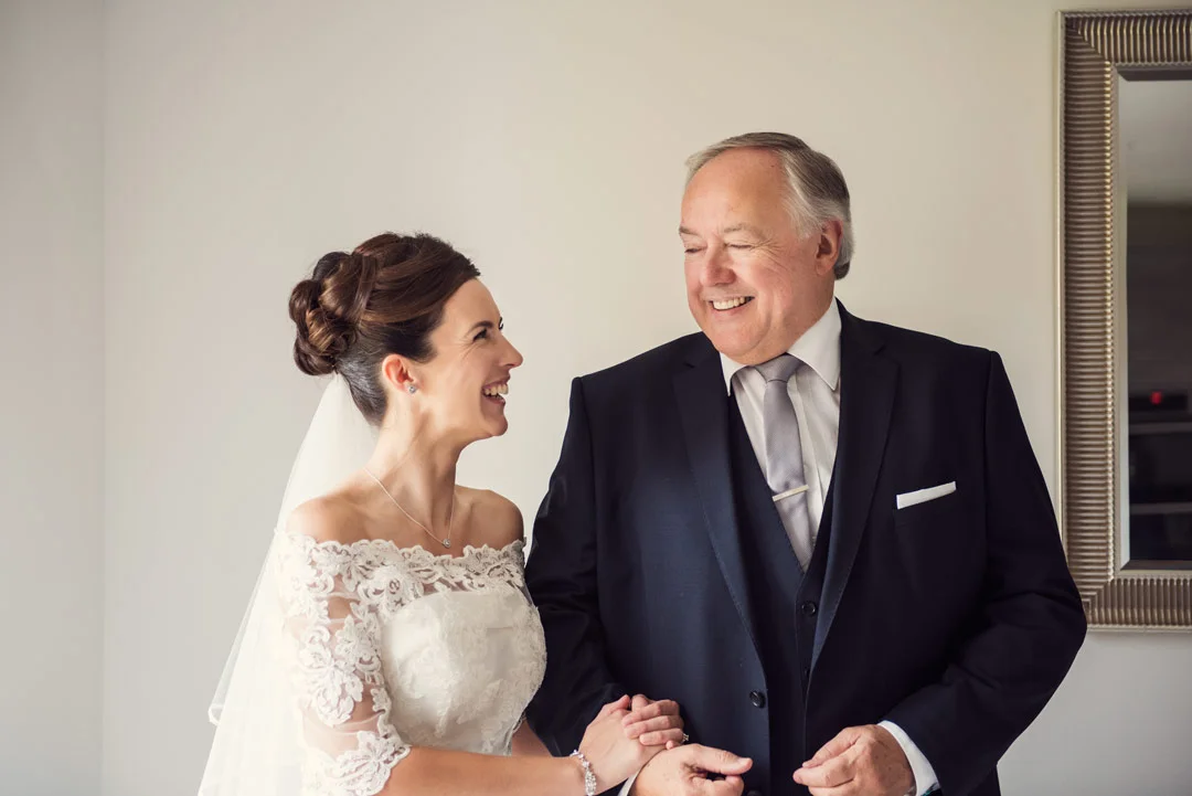 Father and Bride laughing together 