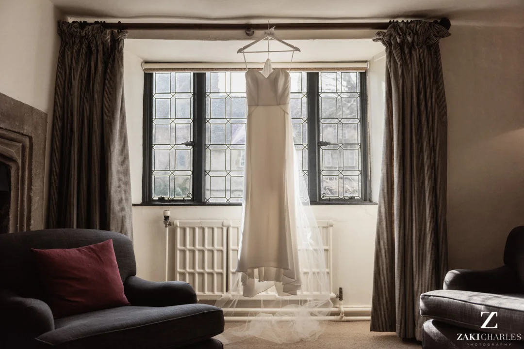 Wedding dress hanging in the sunlight