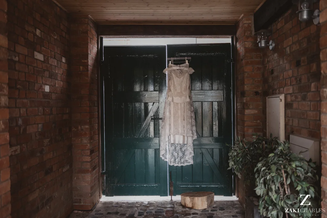 Wedding dress hanging in the sunlight