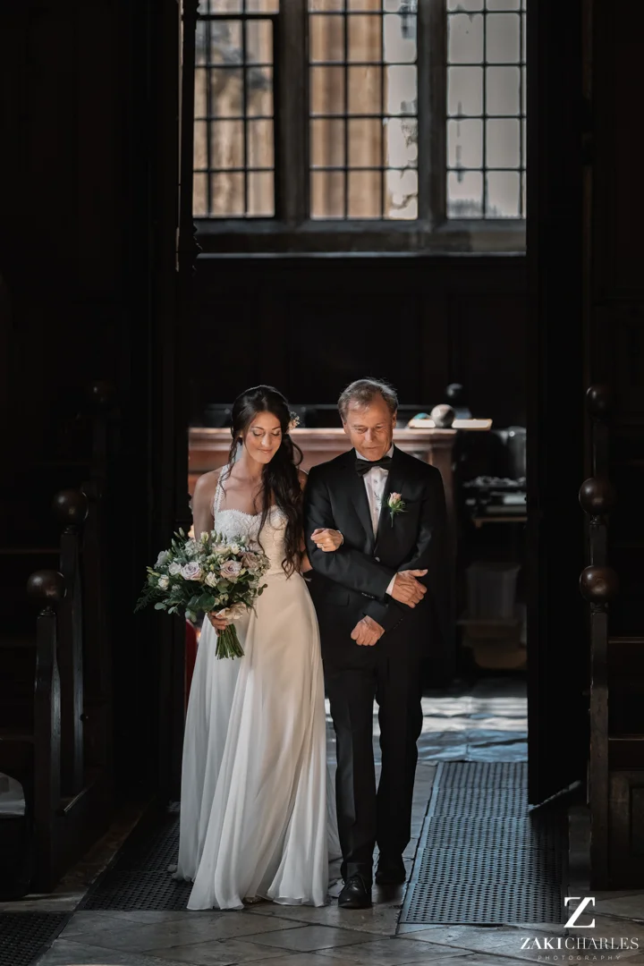 Bride walking down the aisle at The Bodleian Library