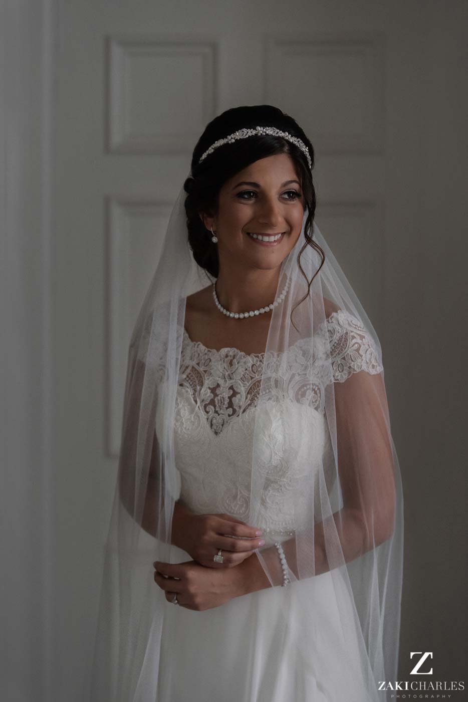 Natural light portrait of the bride smiling