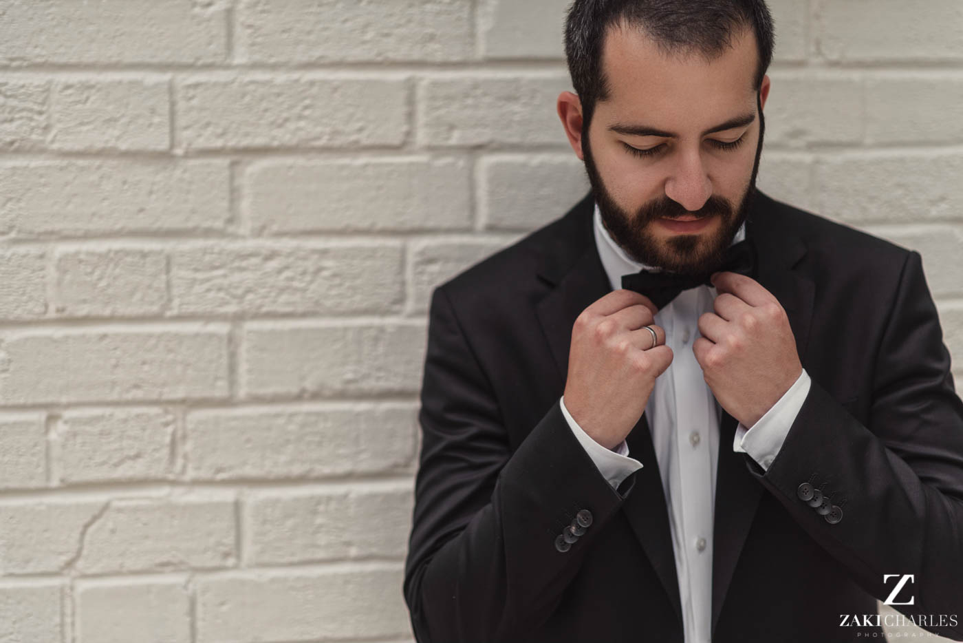 Natural light portrait of groom preperation at Marriott Hotel Regents Park 5