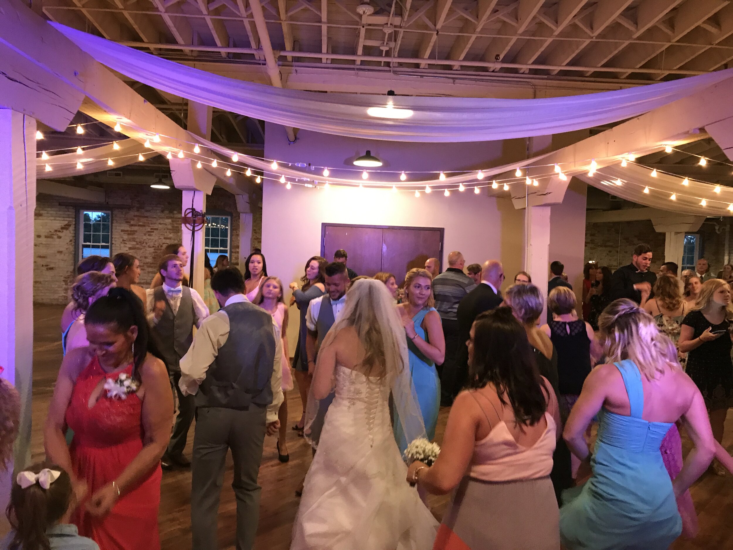 people dancing during wedding reception at Bread &amp; Chocolate in Goshen IN