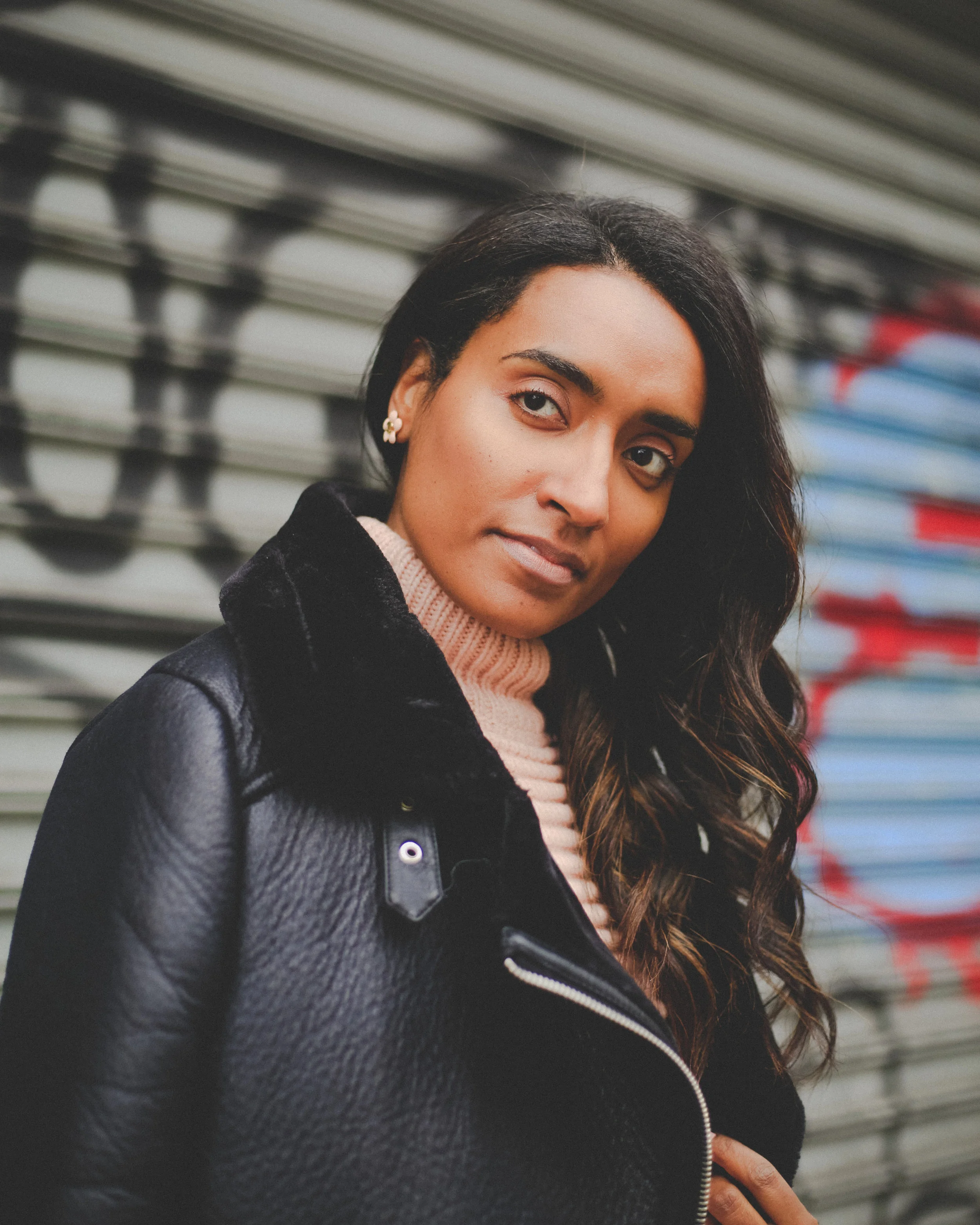 Krys modeling a leather jacket.
