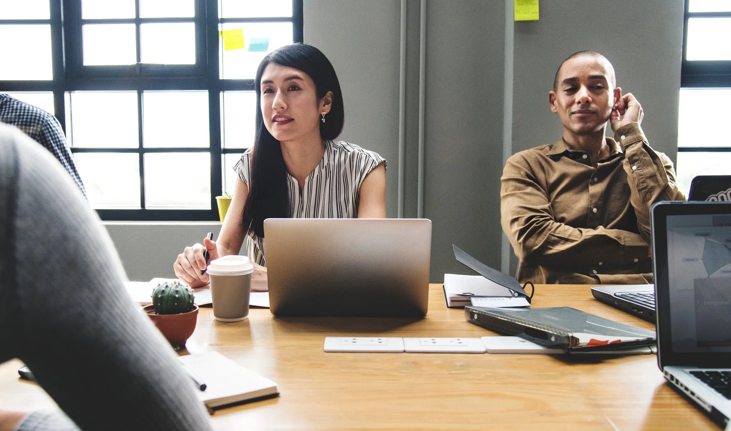 Young diverse professionals in a startup meeting.jpg