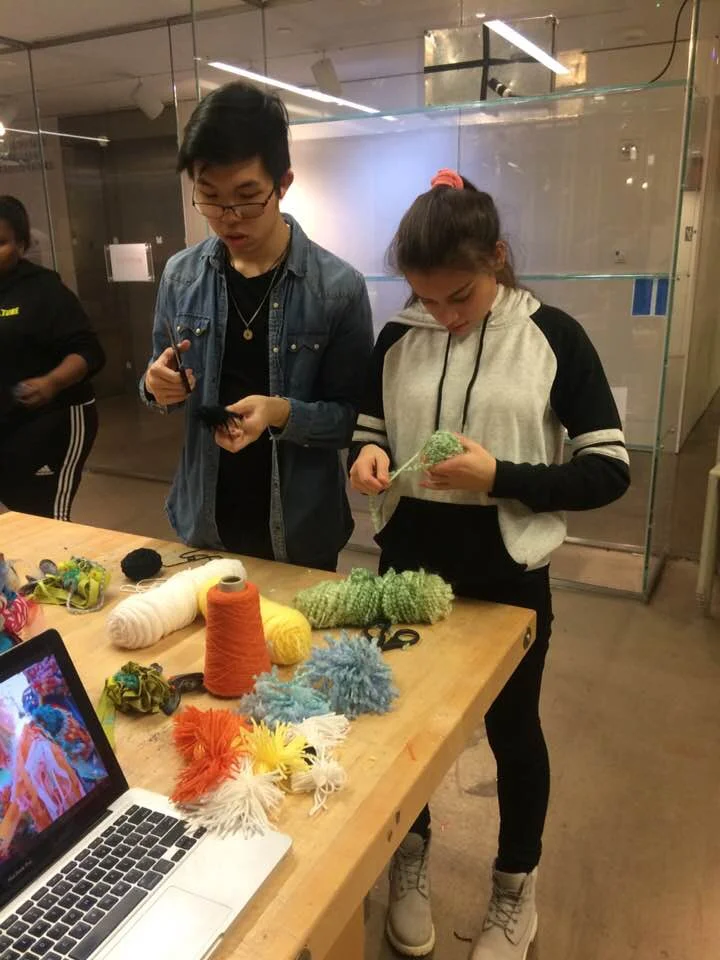 Making some pom-poms together!