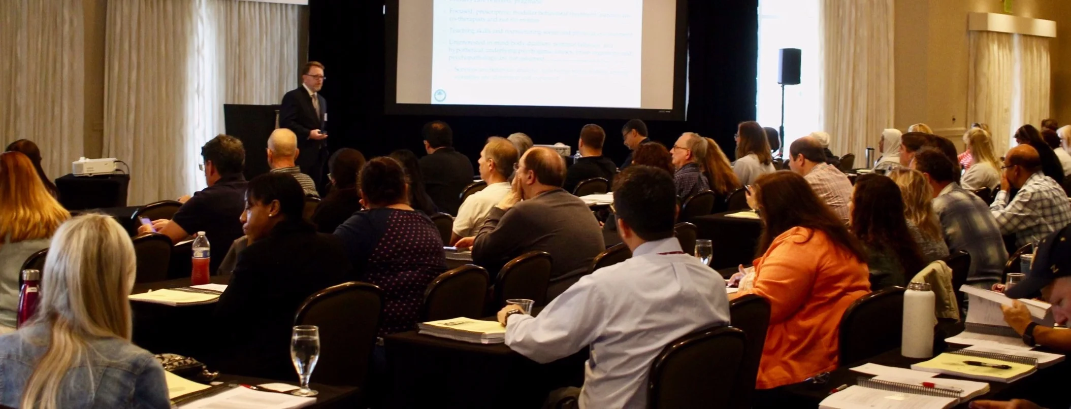 Dr. McGinnis offering an invited training for pediatric physicians and nurses in Southwest Florida