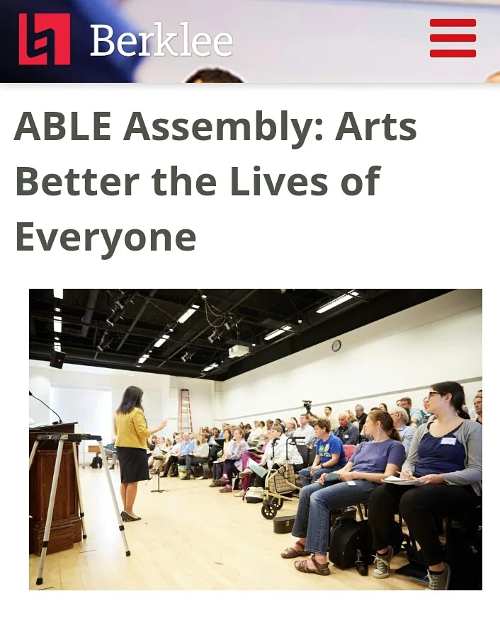 Screenshot of flyer for Berklee College’s ABLE Assembly. Woman in yellow jacket and black dress speaks to an auditorium full of people sitting and listening attentively, some taking notes others just watching.