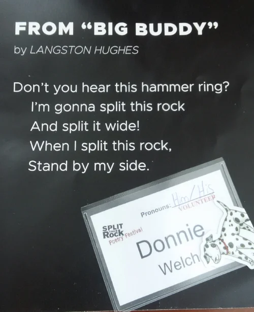 excerpt of Langston Hughes poem “Big Buddy” title, author, and poem excerpt in bold white letters on a black background. Square, Split This Rock Poetry Festival name tag in square plastic case. “Donnie Welch” written in black lettering. A cartoon dalamation sticker is in the bottom right corner of the badge.