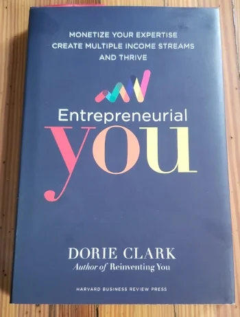 Still of Dorie Clark’s Enrepreneurial You , hardcover edition on a wooden table