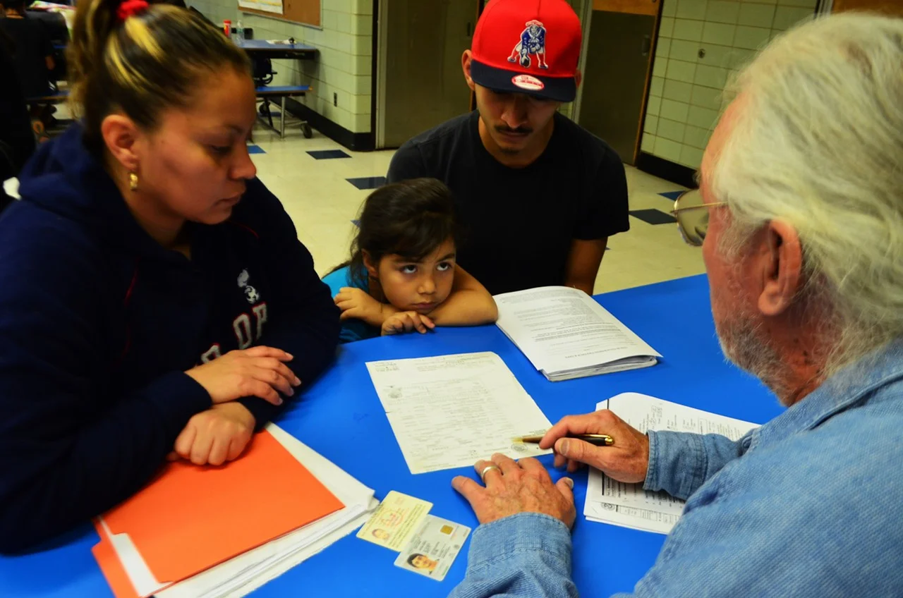 Jazmin Huguez, Eliot Ortega and volunteer Steve Johnston at Keep Tucson Together’s educational clinic at Pueblo High School.
