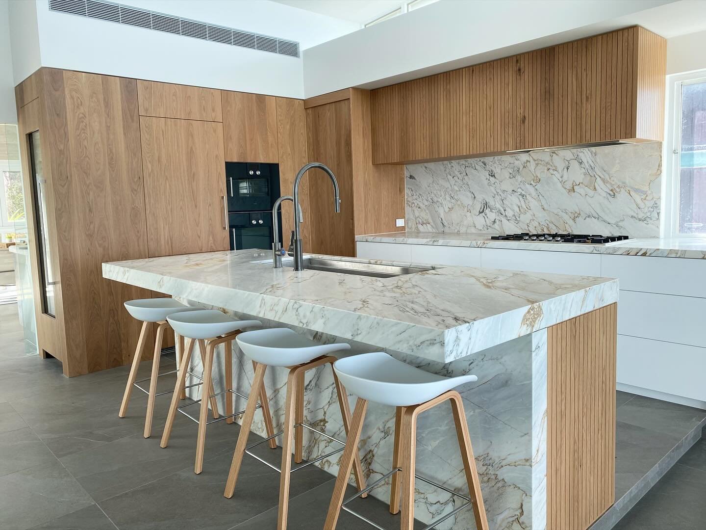 Main kitchen from our Eggleston Project. American White Oak, with a Raw finish. All hand veneered for a true custom appearance. Overheads with square groove profile to match the island panels. Lots of work in this one and very satisfied with the outc