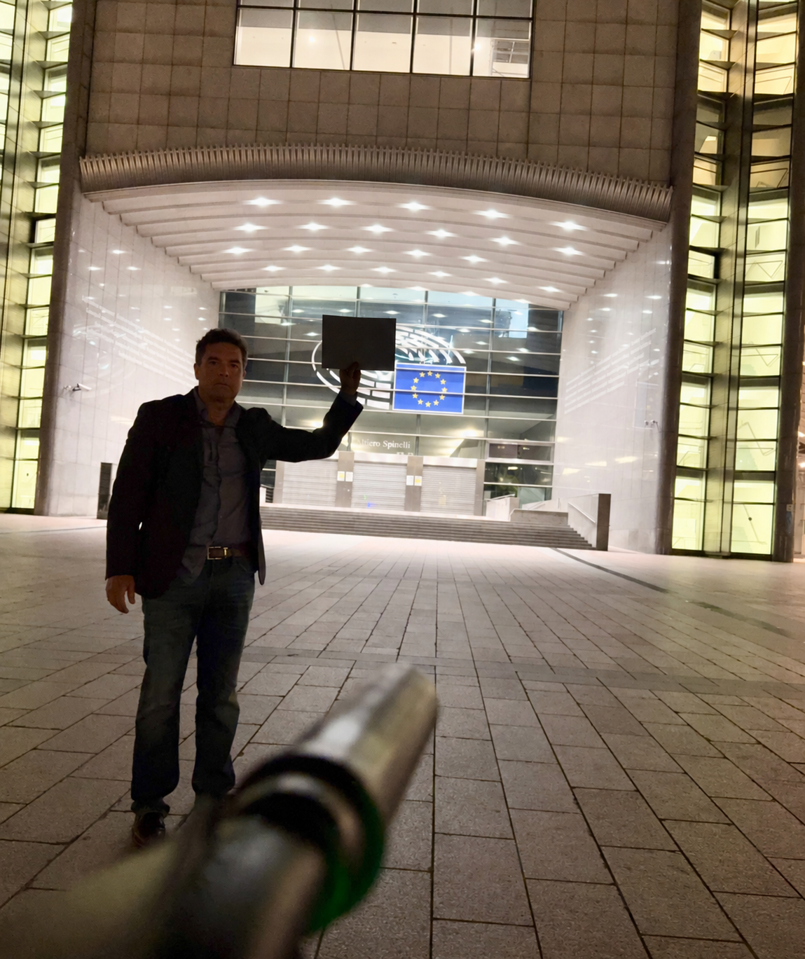 Nighttime Plaza with Dark Sign at EU Building.png